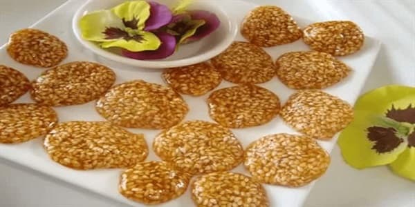 تصویر 1 از قیمت خرید پولکی کنجدی عسلی عمده به صرفه و ارزان